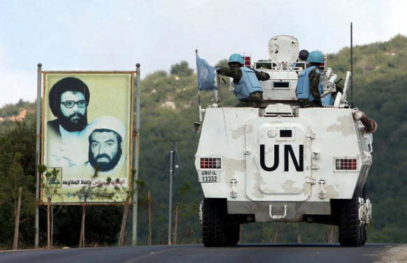 A UN vehicle carrying members of the UNIFIL peacekeeping force passes a Hezbollah billboard. UNIFIL’s sole job was keeping southern Lebanon free of armed groups like Hezbollah. Instead, UNIFIL ignored Hezbollah terrorists building a massive terrorist infrastructure to attack Israel.